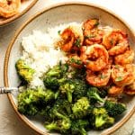 Closeup on a bowl of a honey sriracha shrimp bowl with white rice.