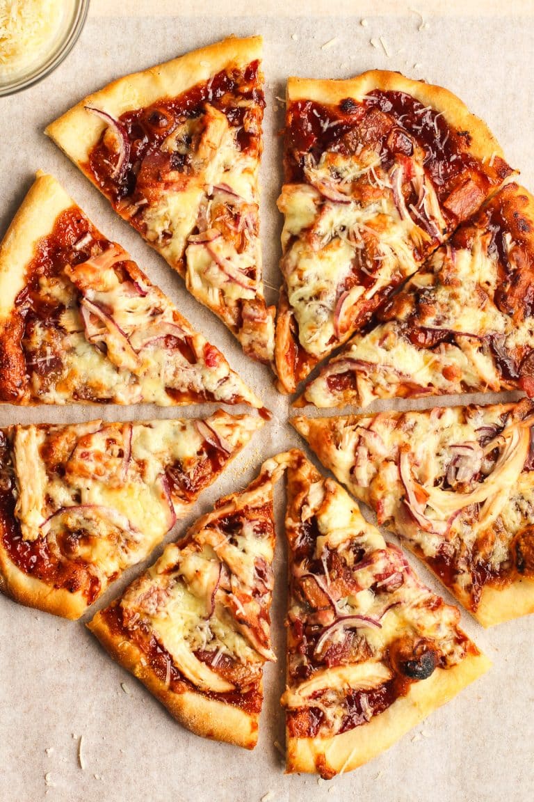 A BBQ chicken pizza sliced into 8 pieces.