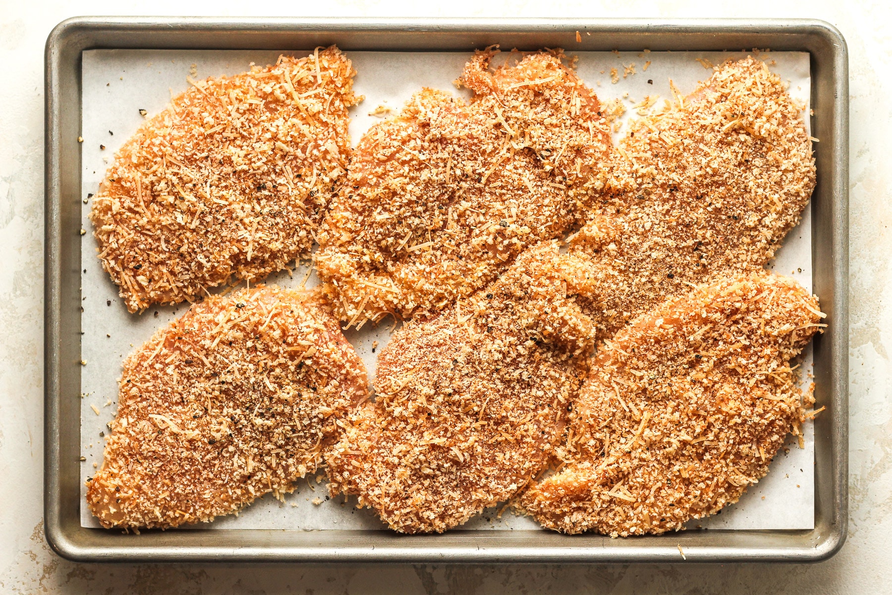 A pan of the Panko chicken cutlets before cooking.