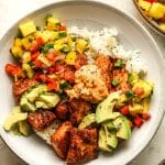 Closeup on a blackened salmon bowl with pineapple salsa.