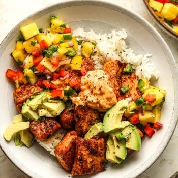 Closeup on a blackened salmon bowl with pineapple salsa.
