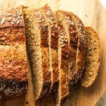 Closeup on some sliced seeduction bread.