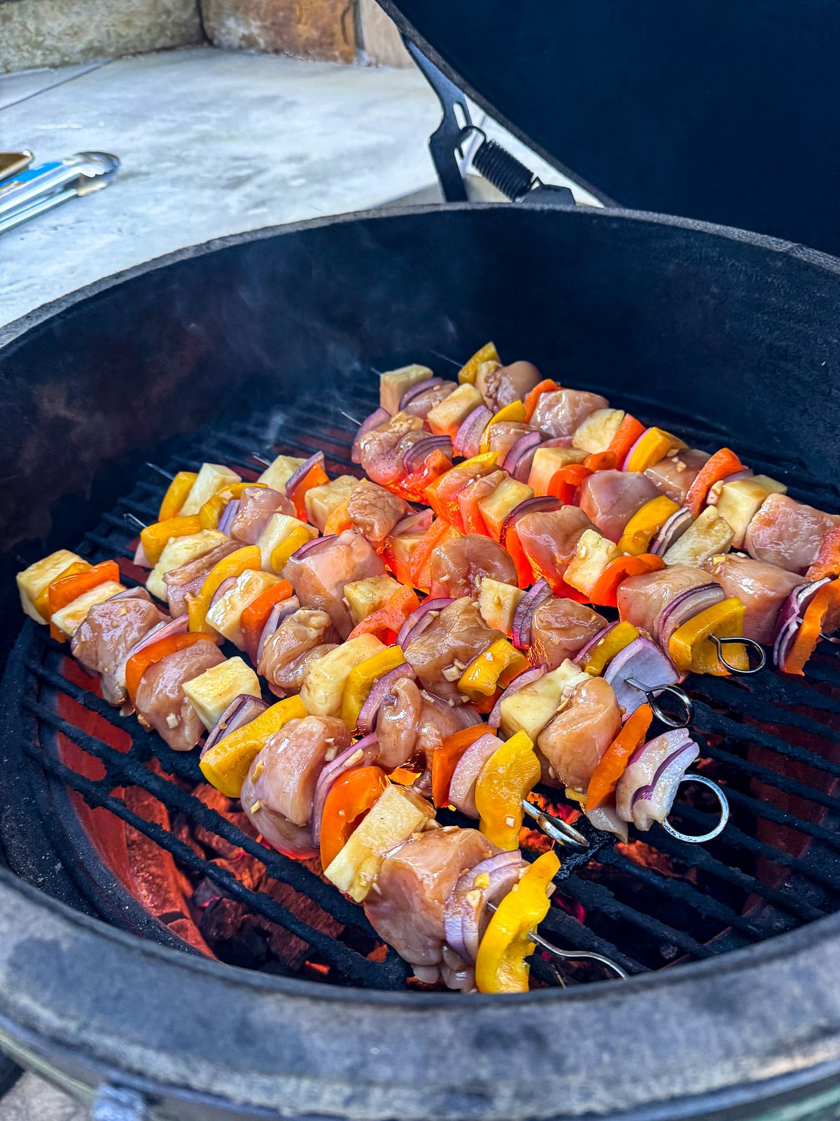 A view of the kabobs after placing on the grill.