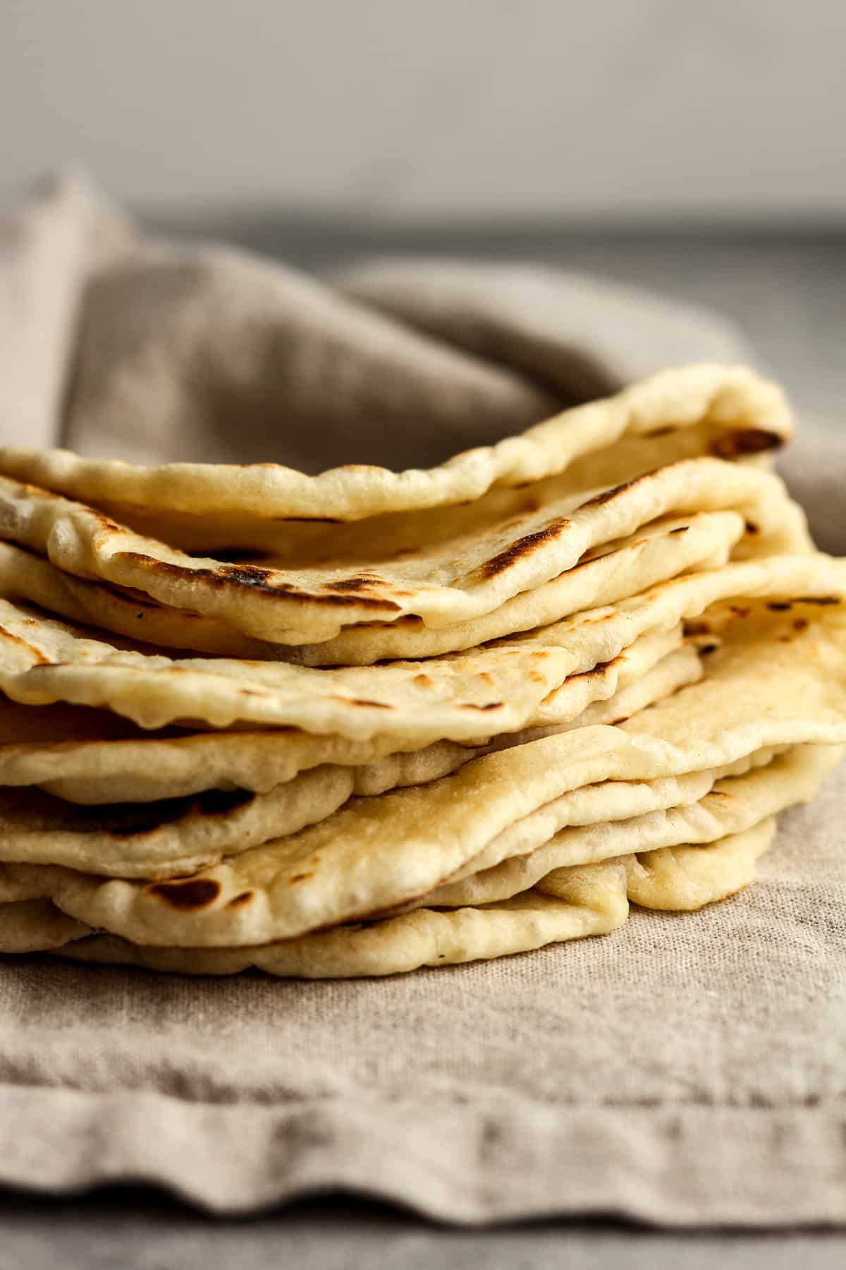 Side view of some folded over homemade tortillas.