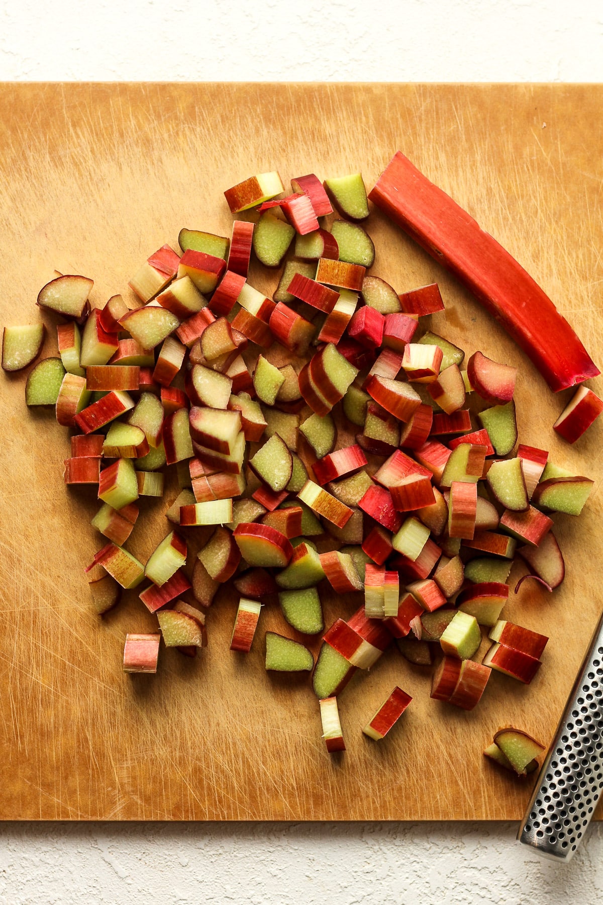 A cutting board of the chopped rhubarb.