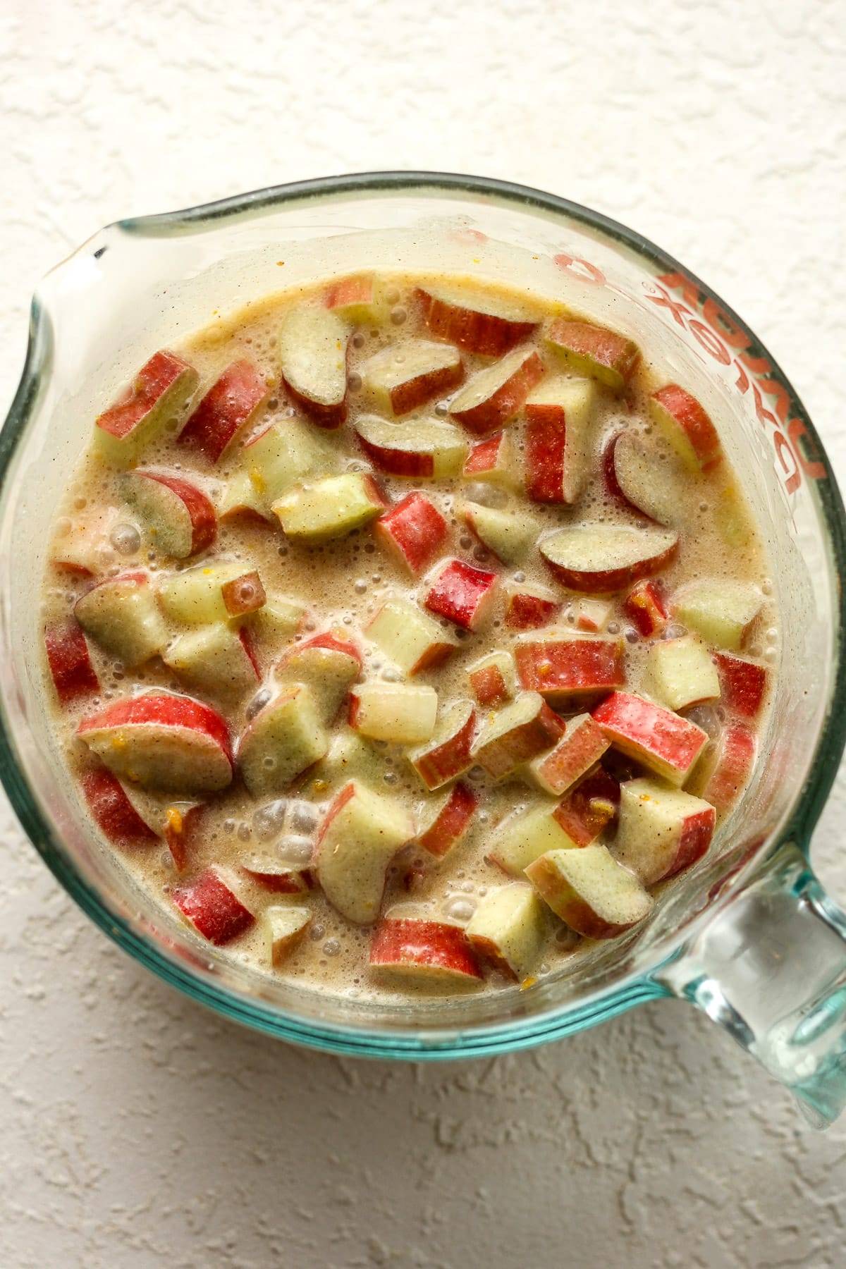 A measuring cup of the rhubarb with custard filling.
