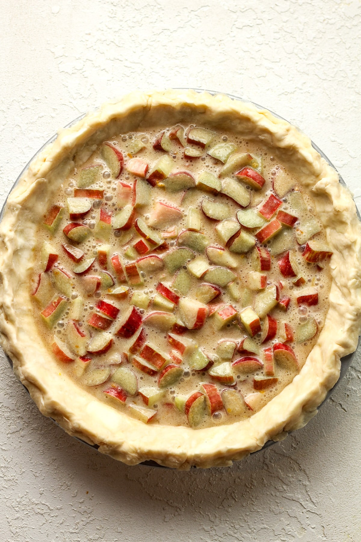 A rhubarb custard pie before baking.