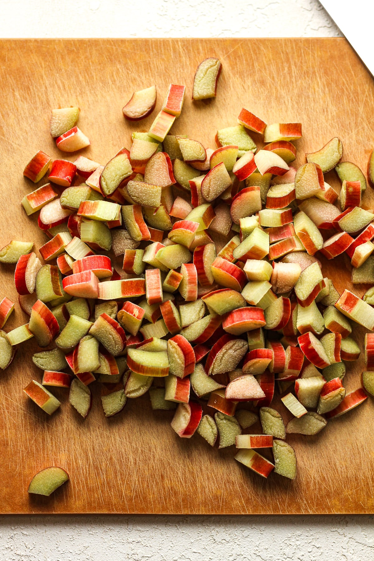A board with some chopped rhubarb.