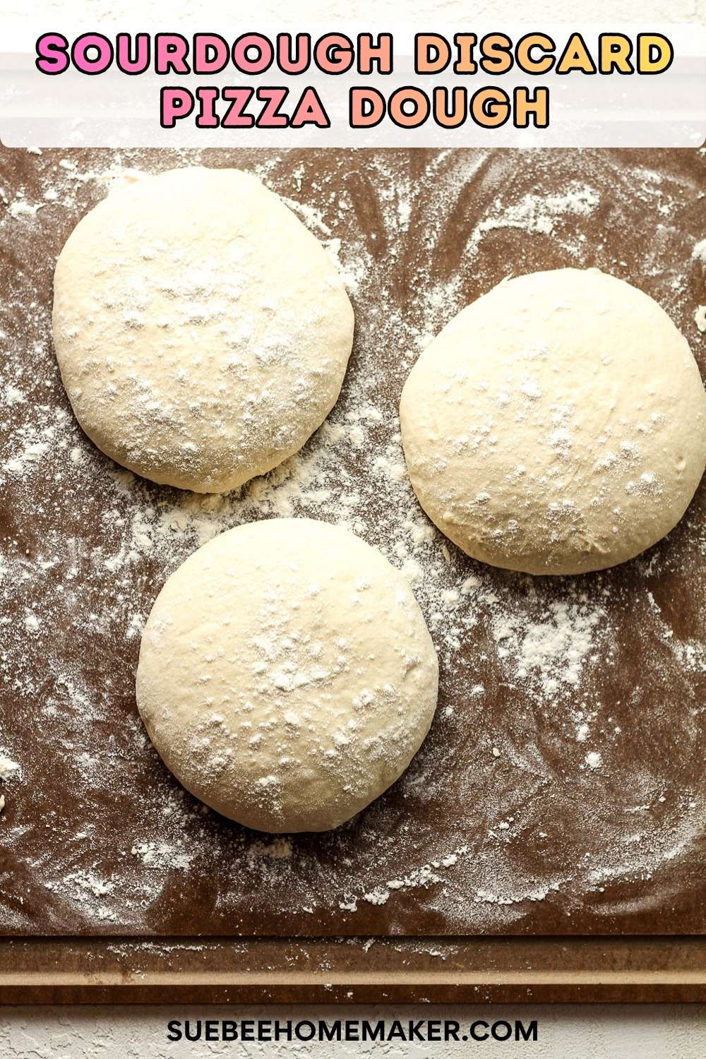 Three rounds of sourdough discard pizza dough on a brown board.