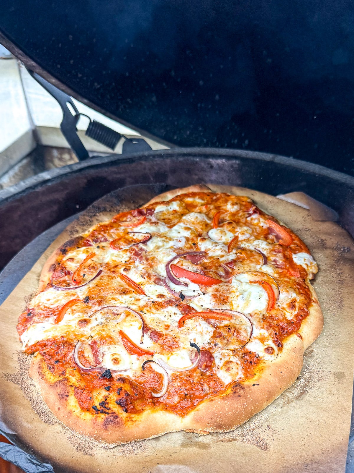 A grilled pizza with vodka pizza sauce.