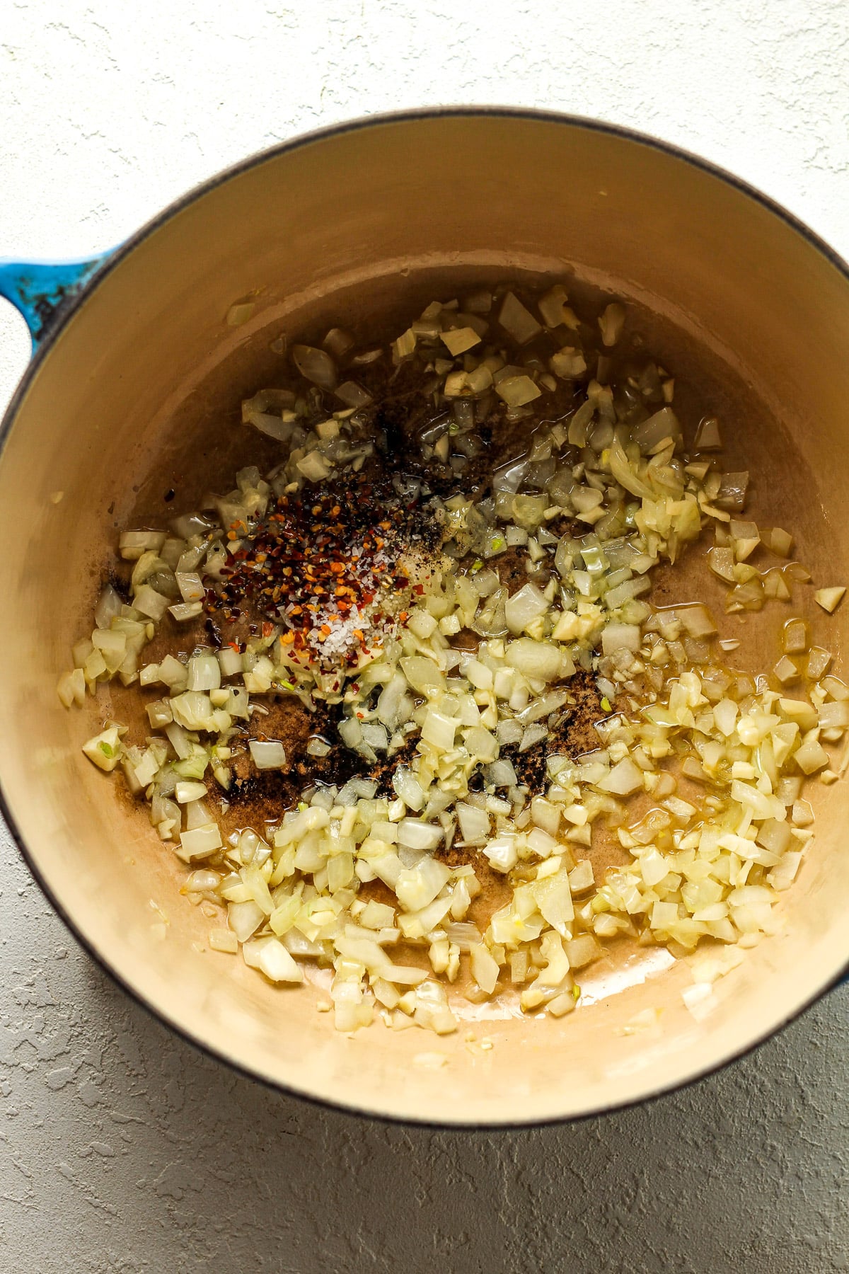 A stock pot of the sauteed onions, garlic, and seasonings.