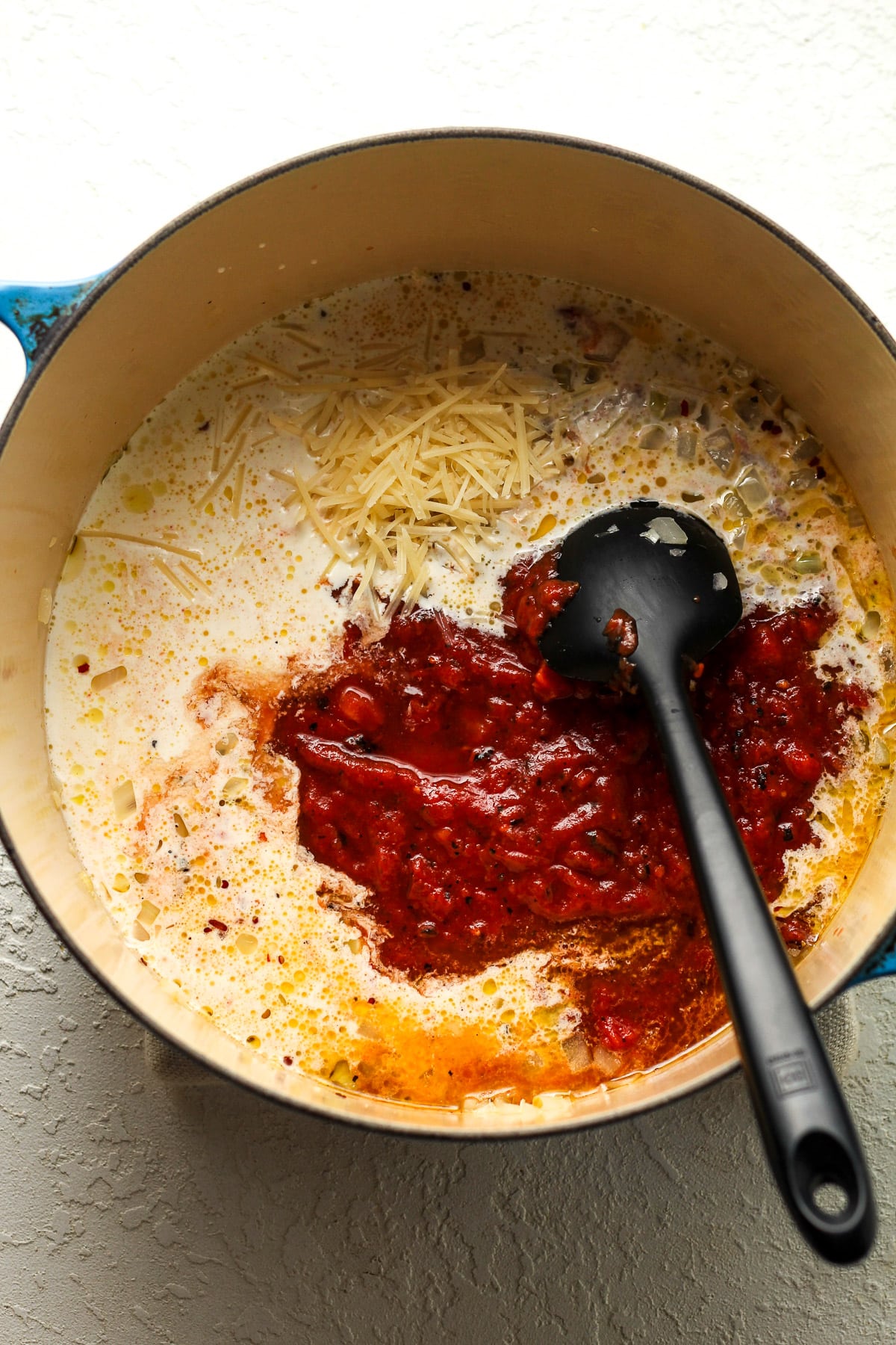 A stock pot of the ingredients added in for the pizza sauce.