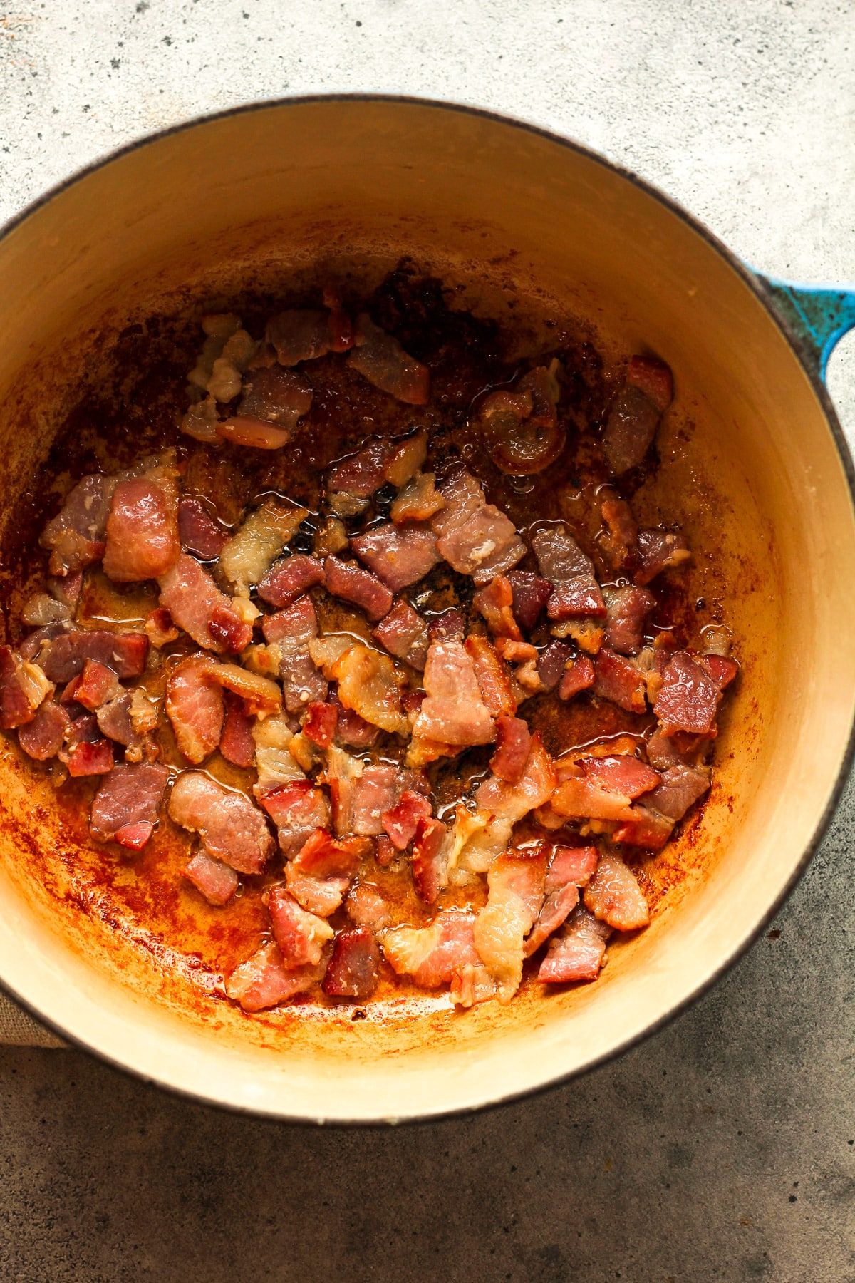 A pot of the cooked bacon.