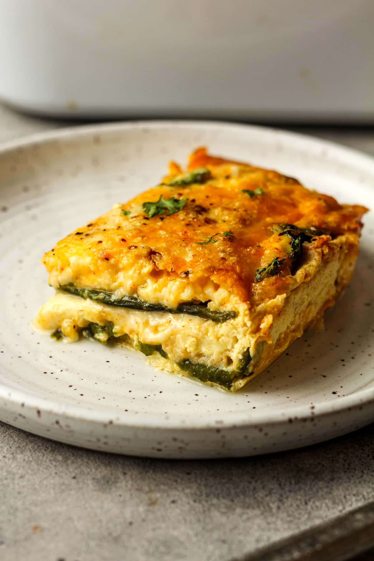 A slice of chile relleno casserole on a plate.
