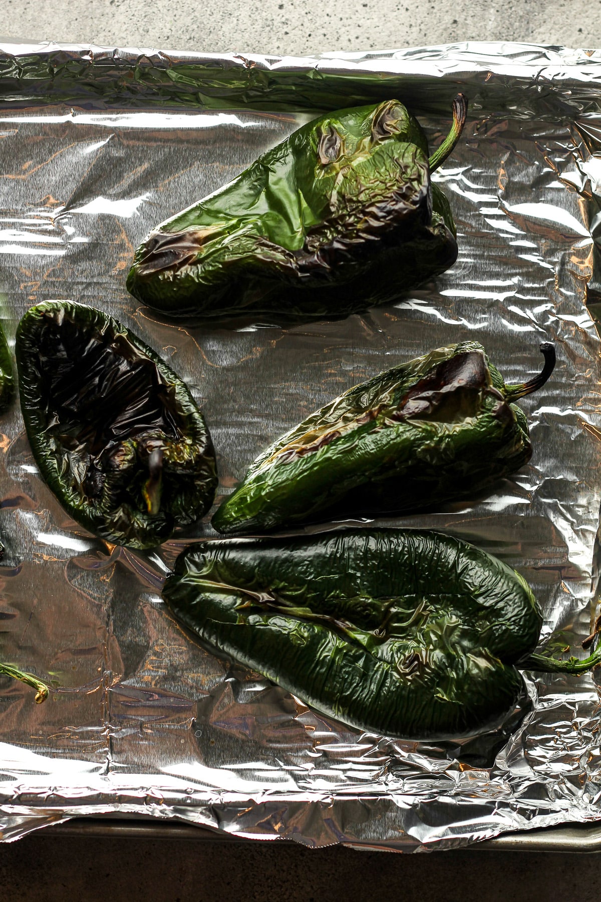 The pan with the just roasted poblano peppers.