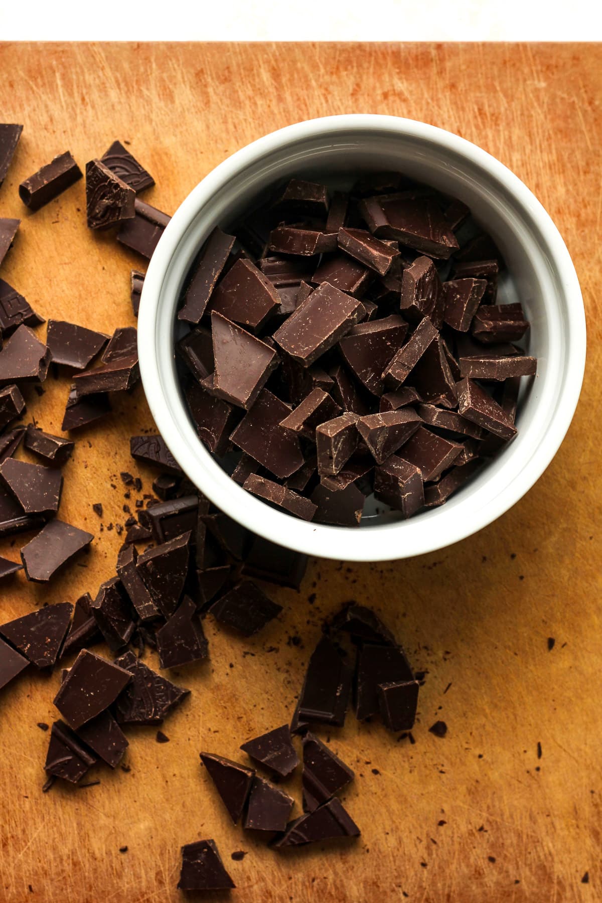 The chopped chocolate on a board.