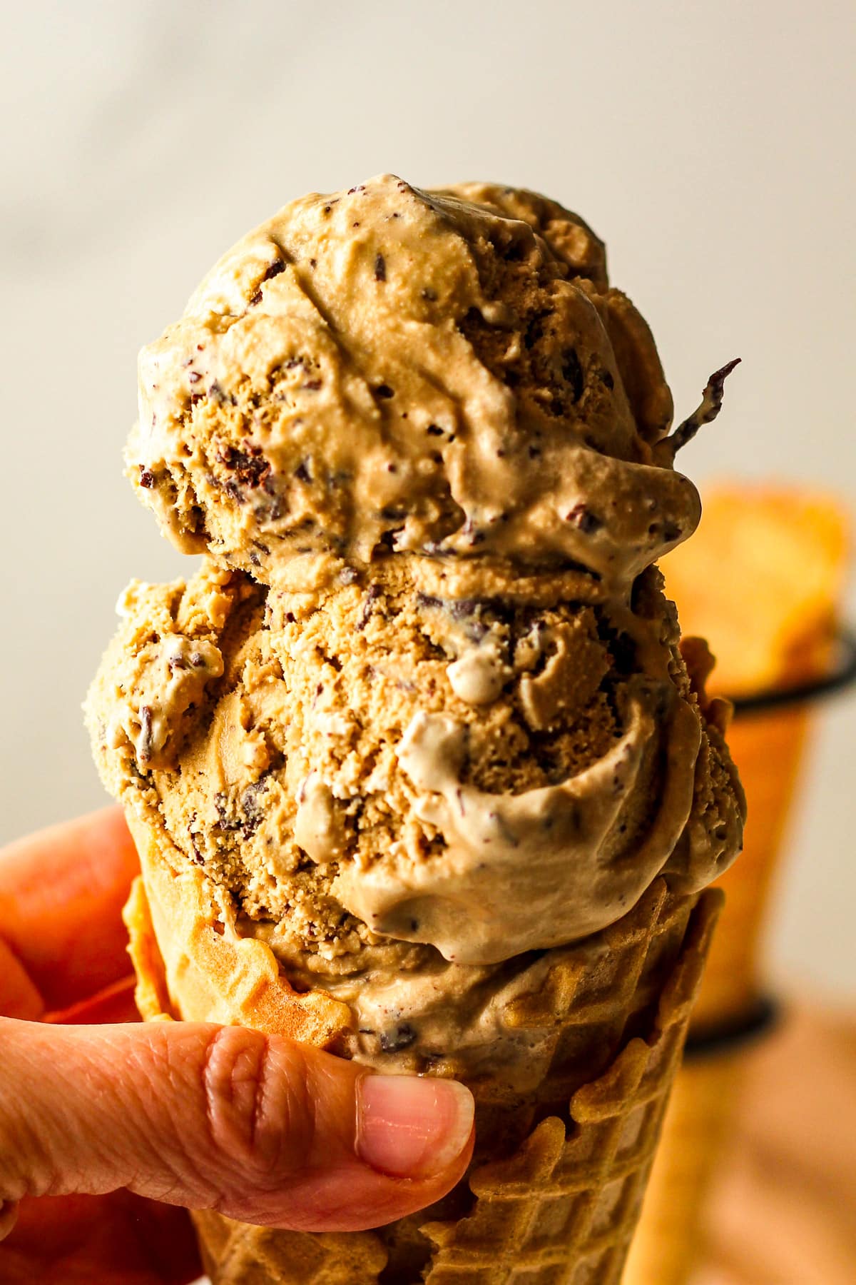 Closeup on a double dip of espresso chocolate chip ice cream.