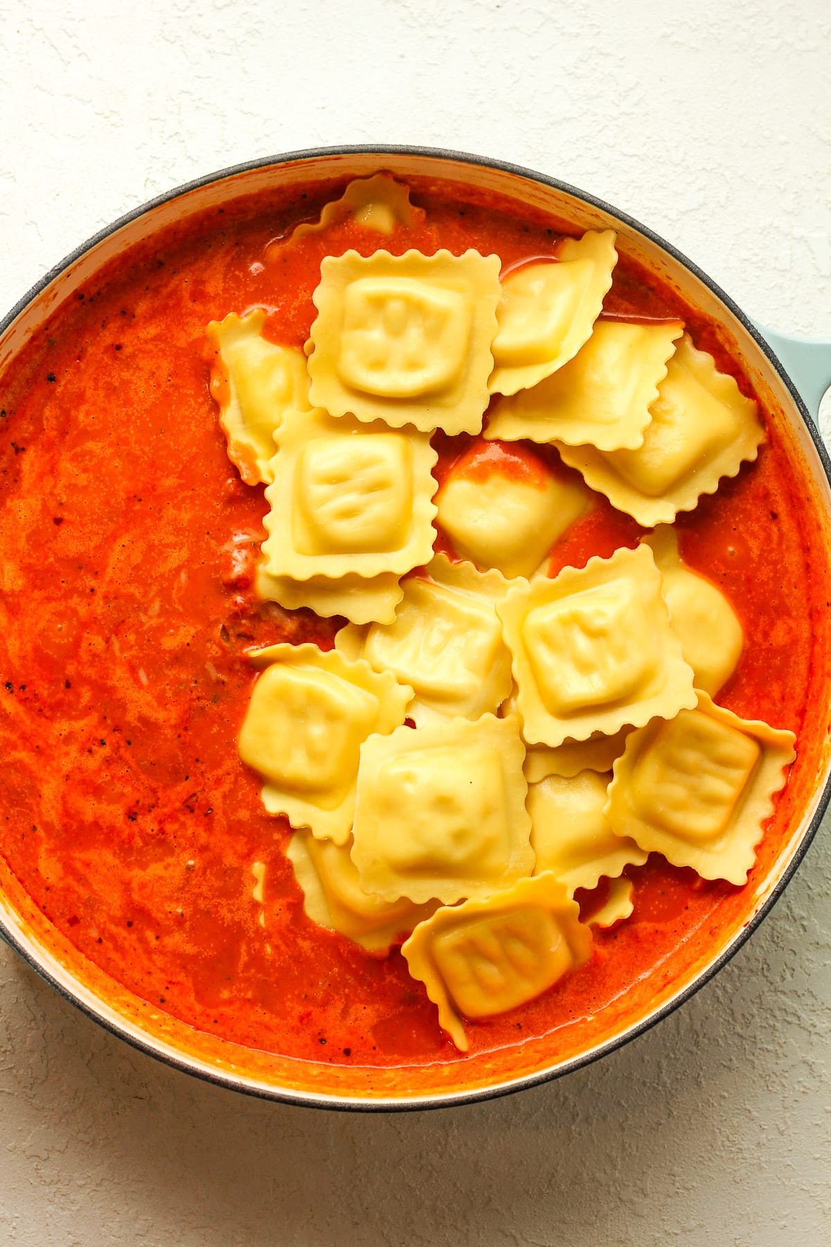 The braiser with vodka sauce plus ravioli on top.