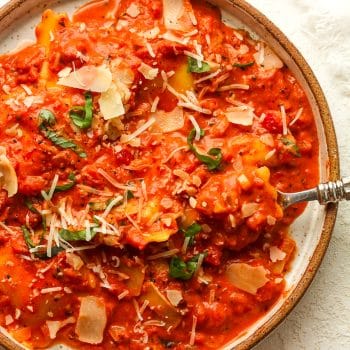 Closeup on a serving plate of ravioli alla vodka.