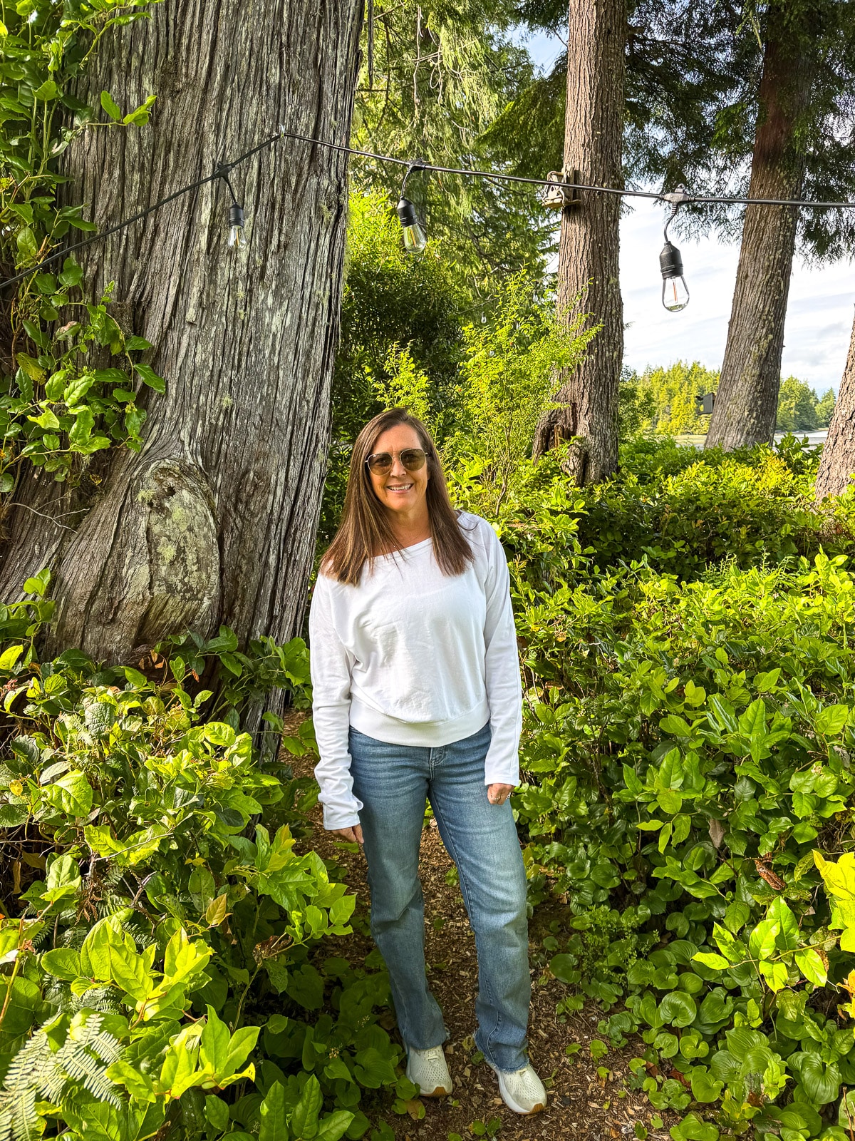 Sue posing in the backyard of airbnb.