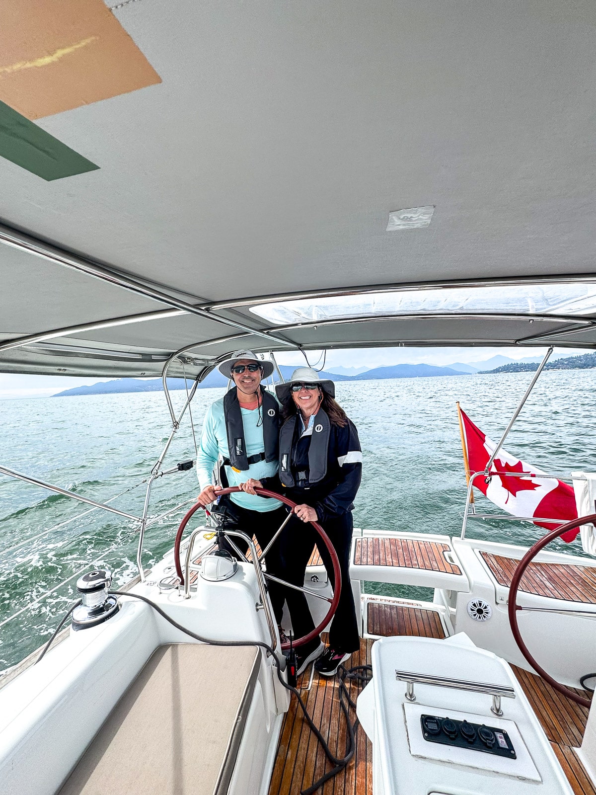 Sue and Mike driving the sailboat.