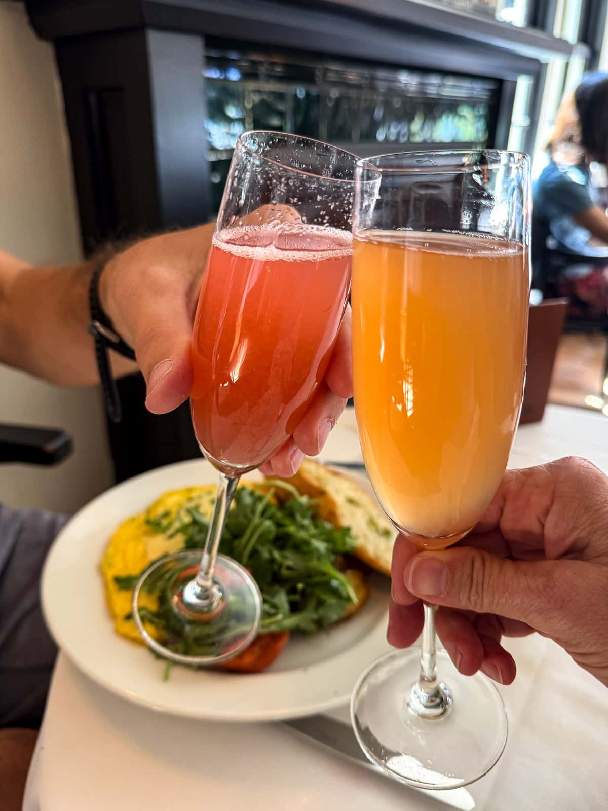 Sue and Mike clinking our mimosas together.