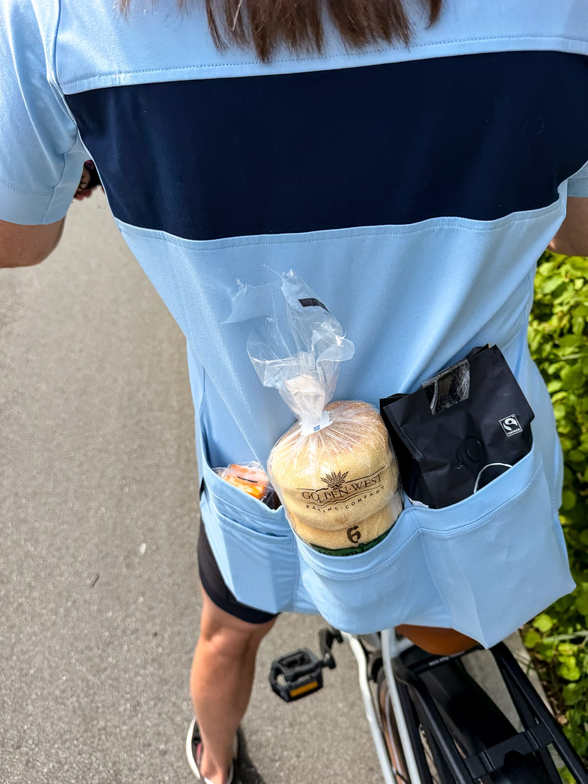 Sue bringing groceries home tucked into my biking shirt.