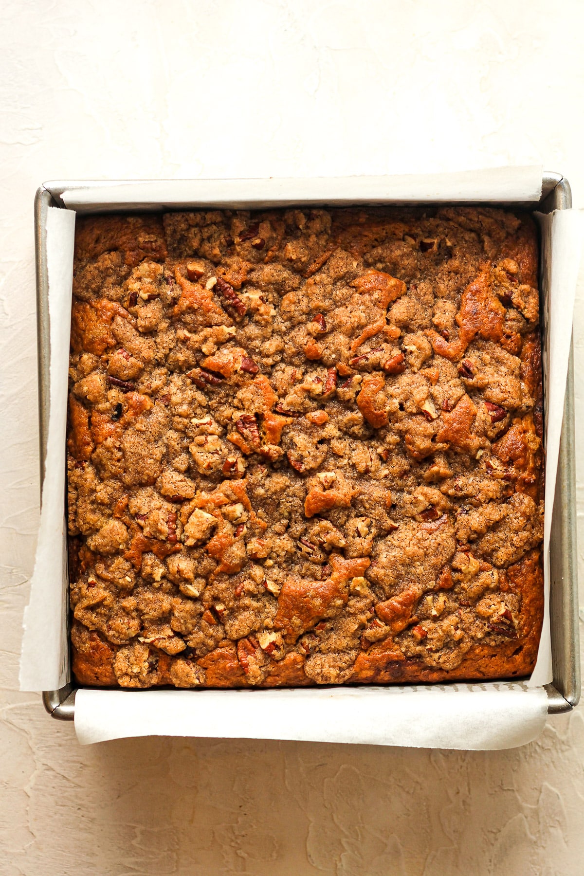 A square pan of the pumpkin crunch cake after baking.