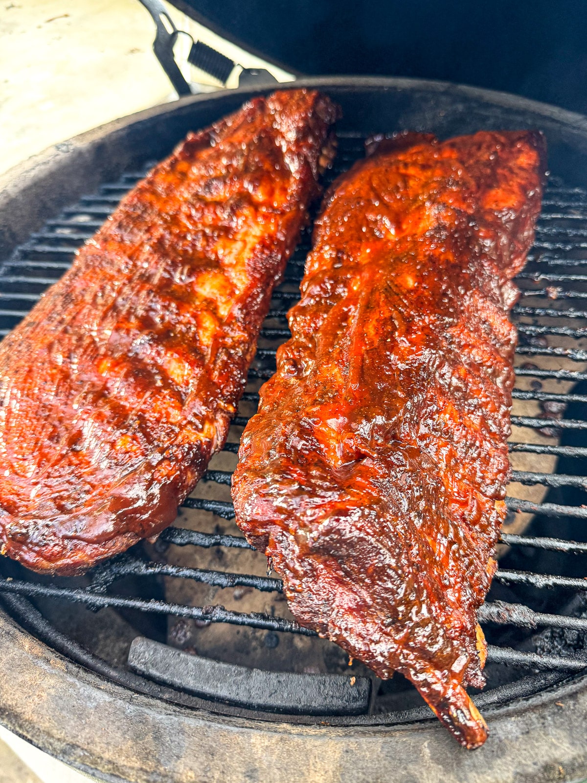 The finished pork ribs on a BGE with barbecue sauce.