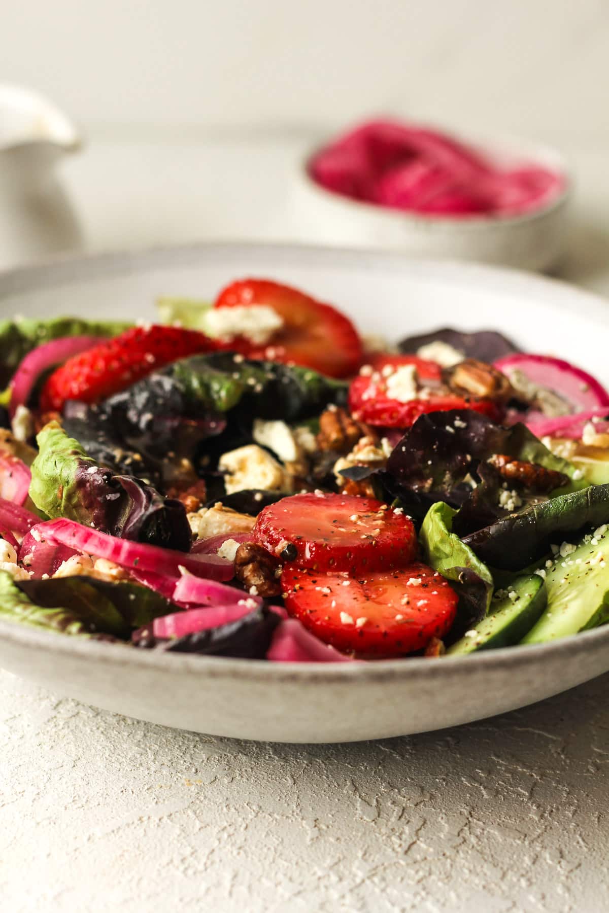 Side view of a serving of strawberry feta salad.