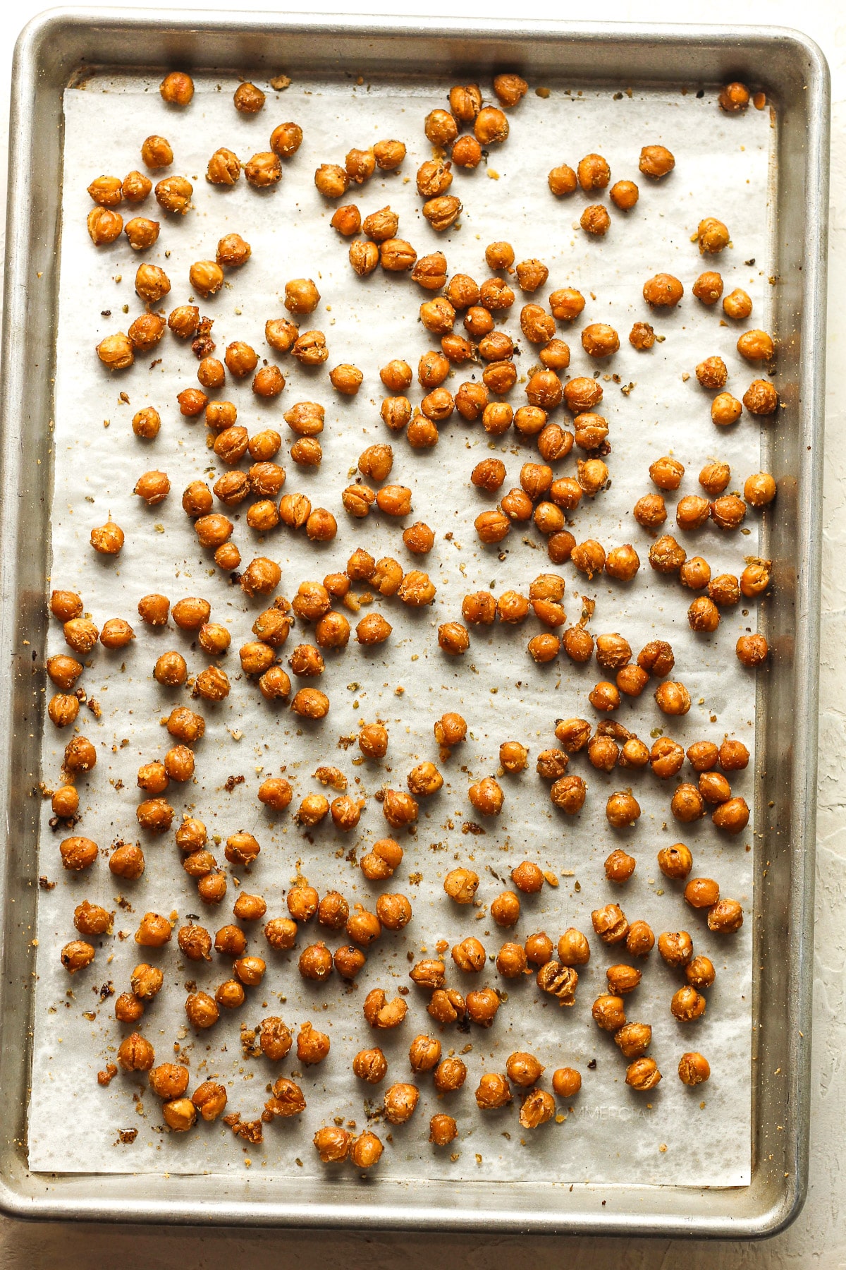 A sheet pan of the crispy chickpeas after roasting.
