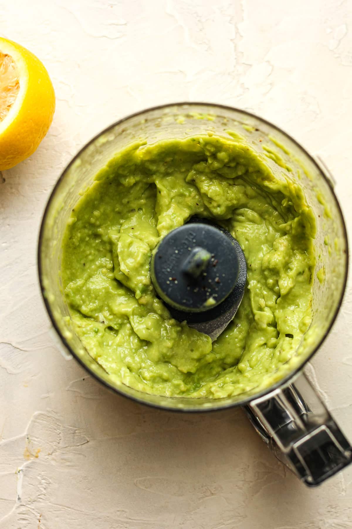 A mini food processor of the avocado dressing.