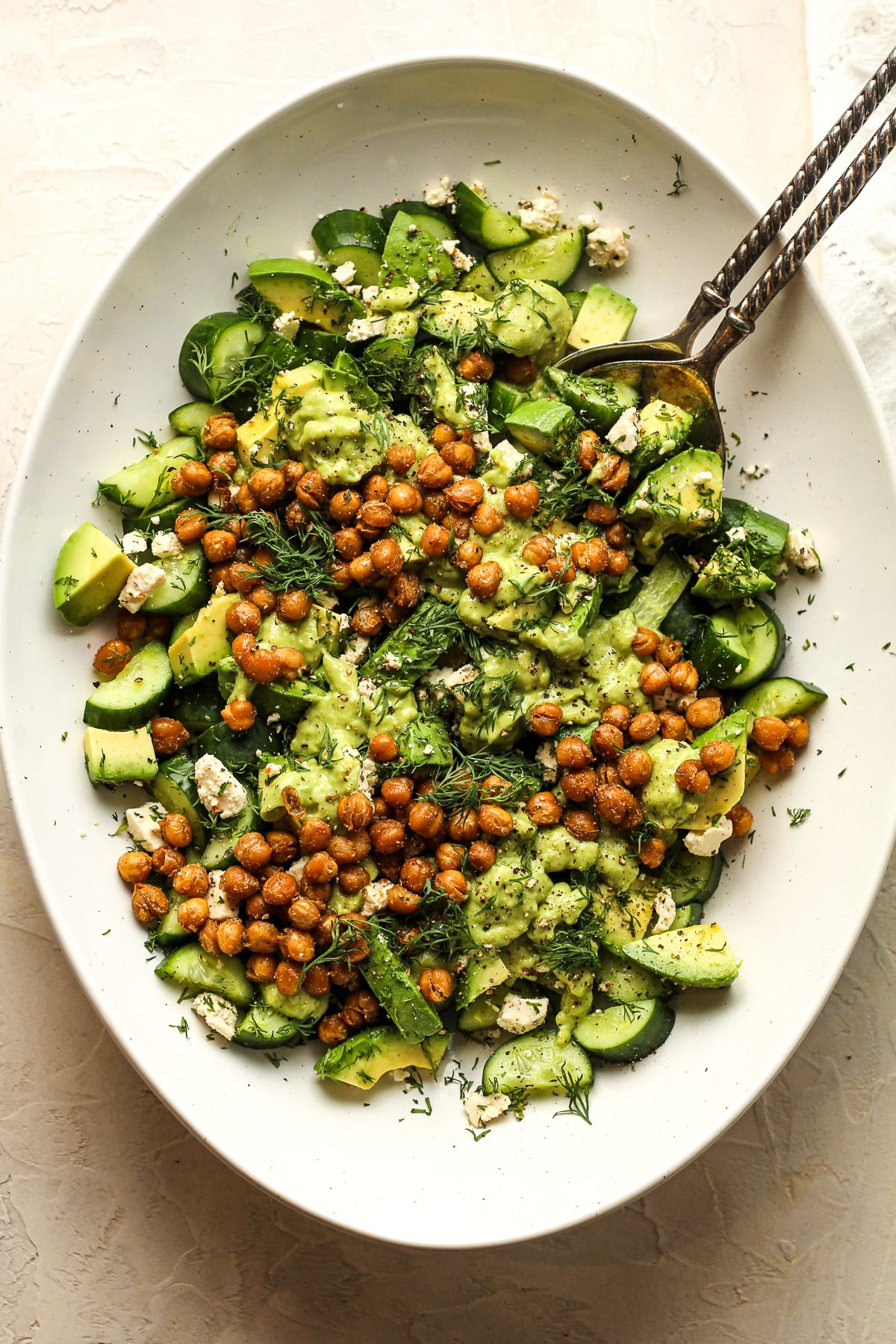 The platter of cucumber salad with avocado and crispy chickpeas.
