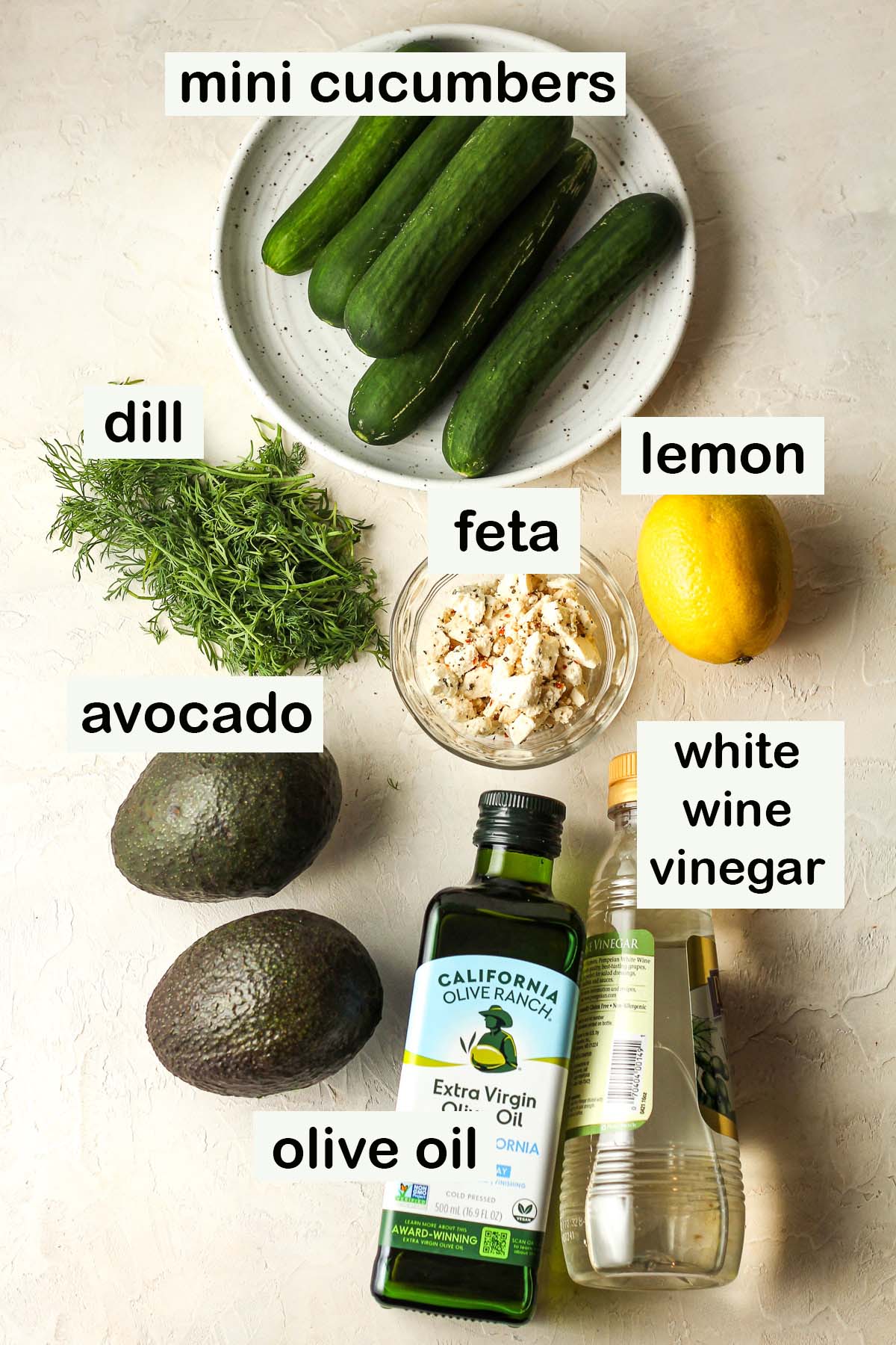 Labeled ingredients for the cucumber avocado salad.