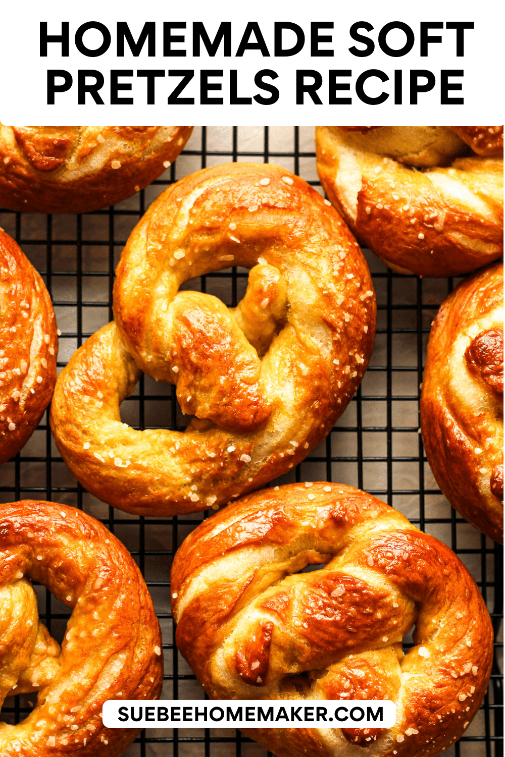 Closeup on some homemade soft pretzels on a wire rack.