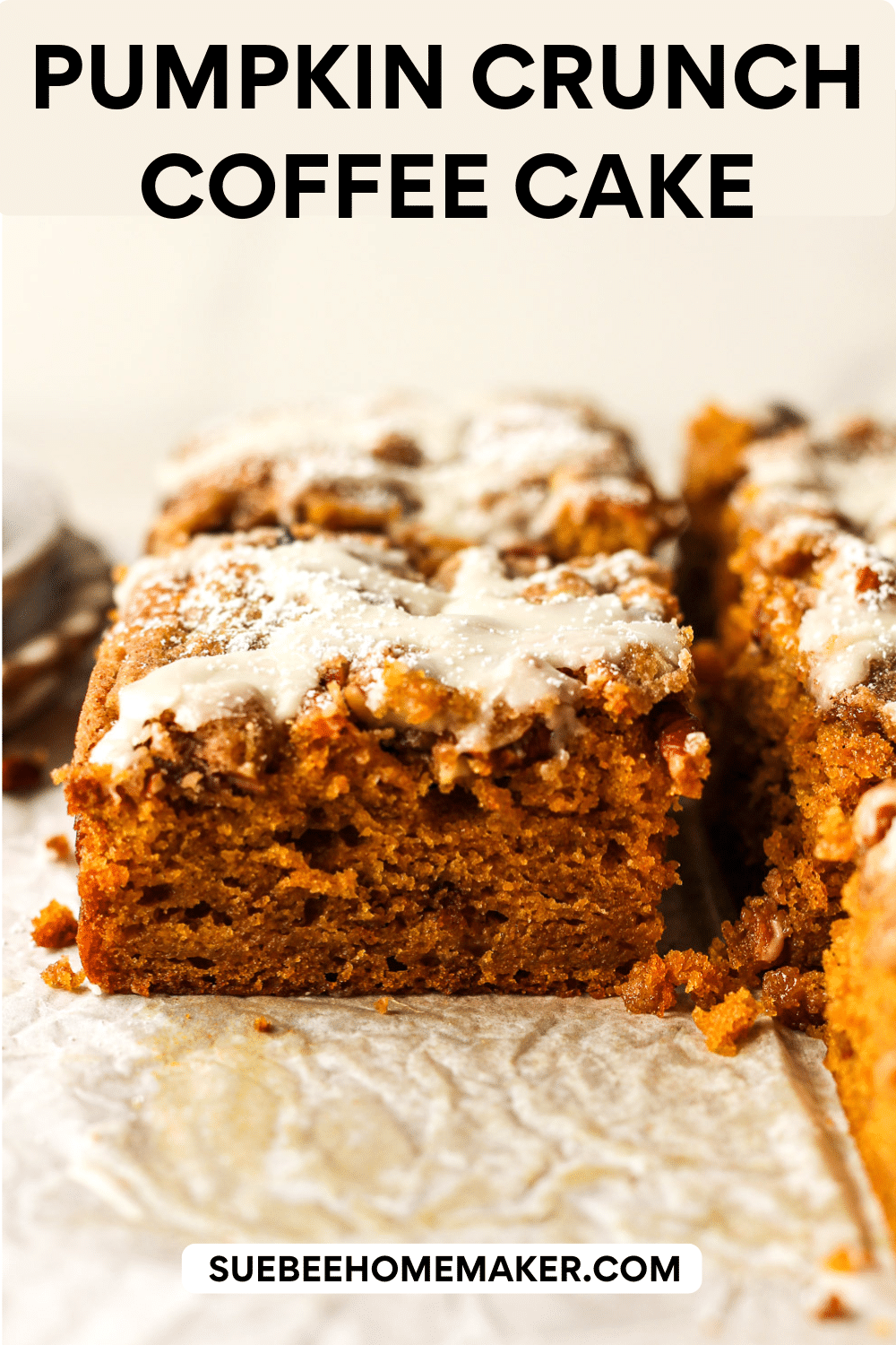 Side view of some sliced pumpkin crunch coffee cake with an icing on top.