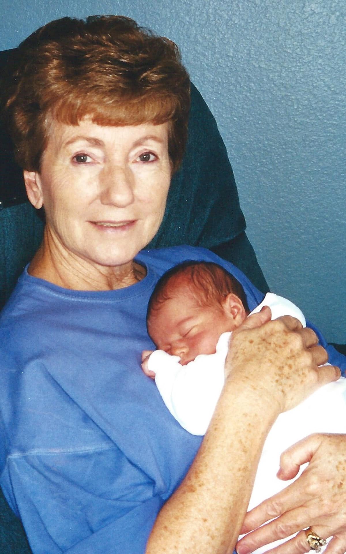 Mom holding Zach as a baby.