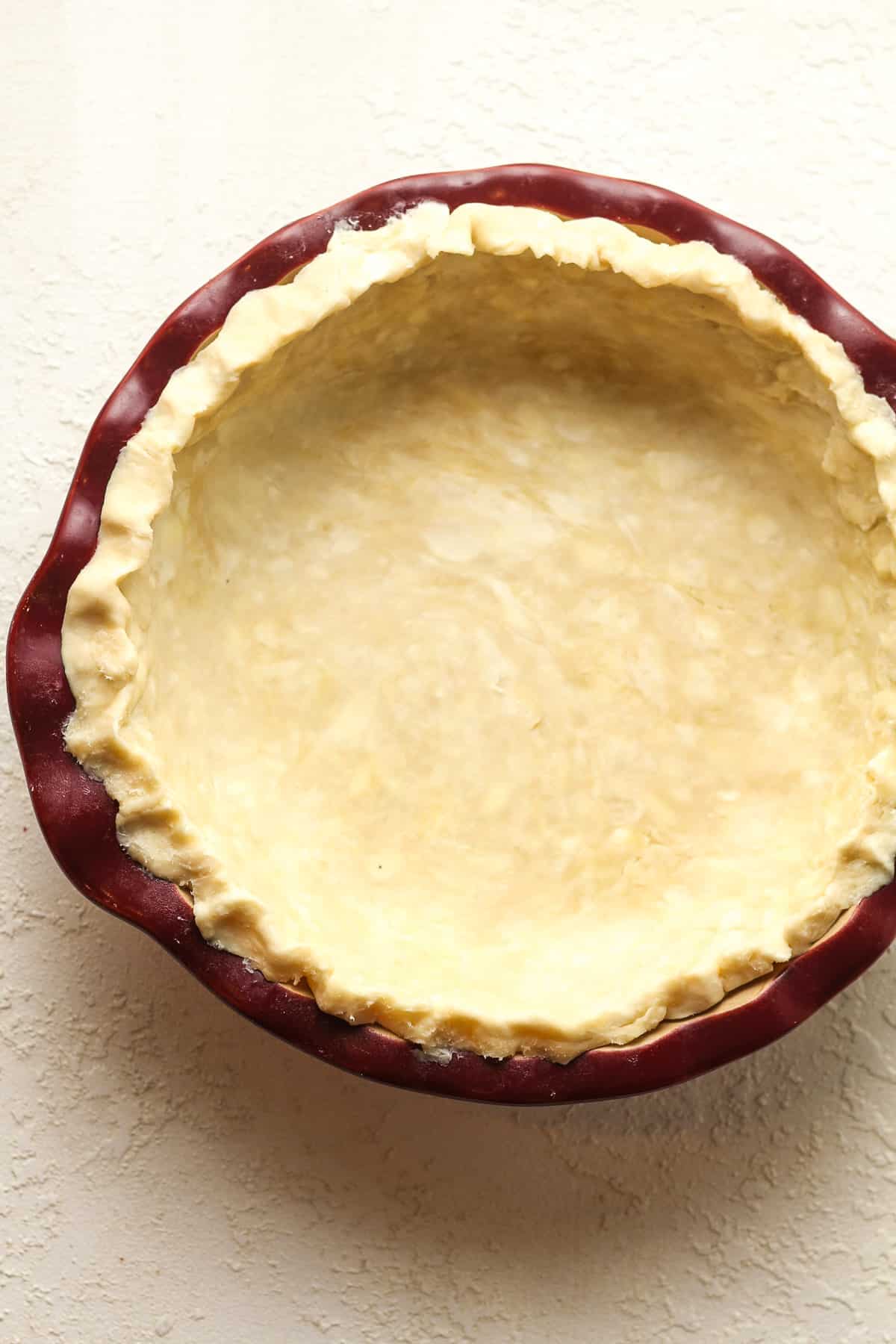 A pie plate with the unbaked crust.