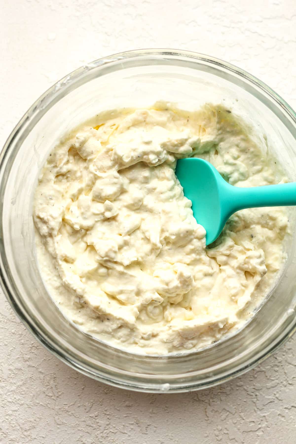 A bowl of the cheese layer ingredients.