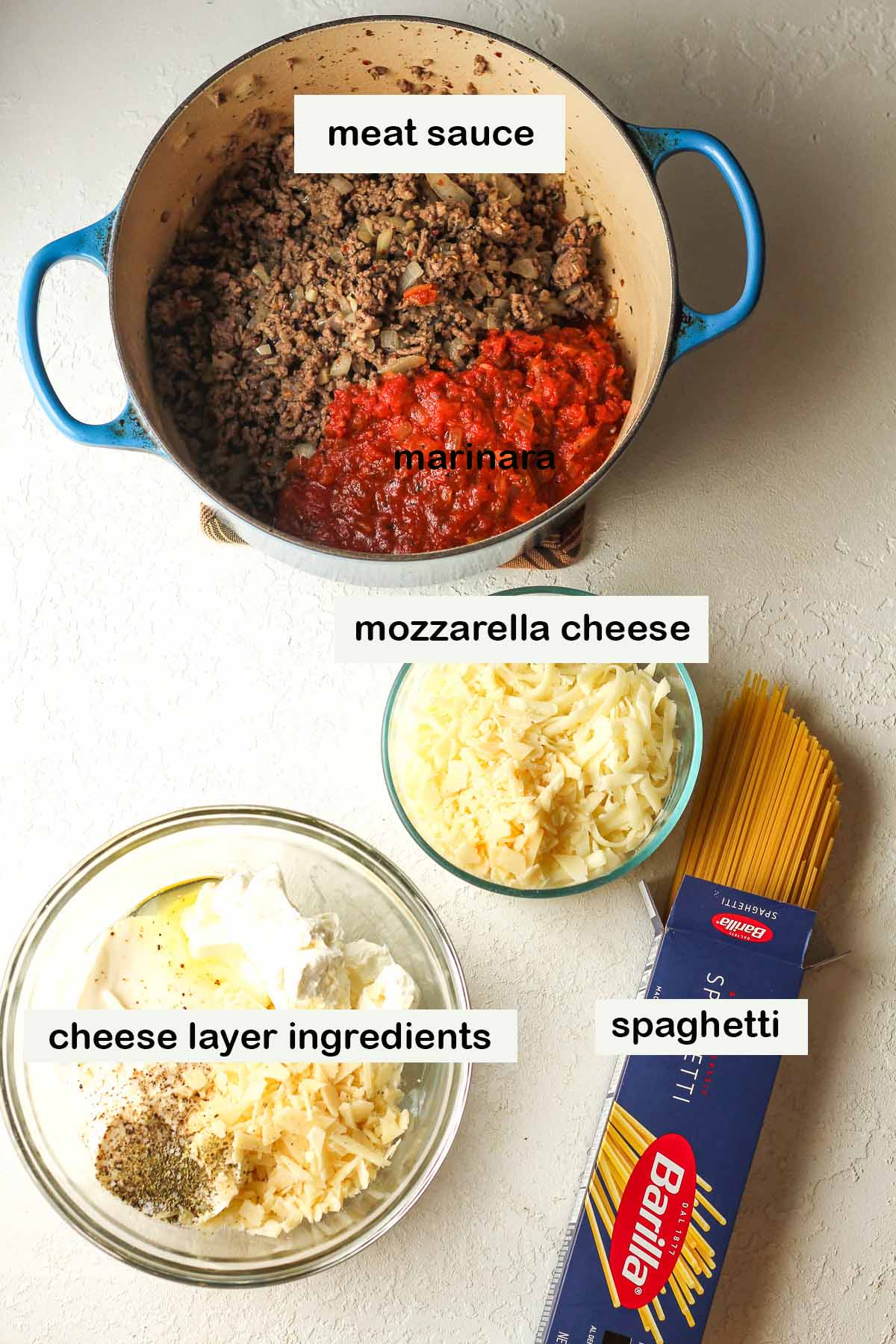 The labeled ingredients for millionaire spaghetti casserole.
