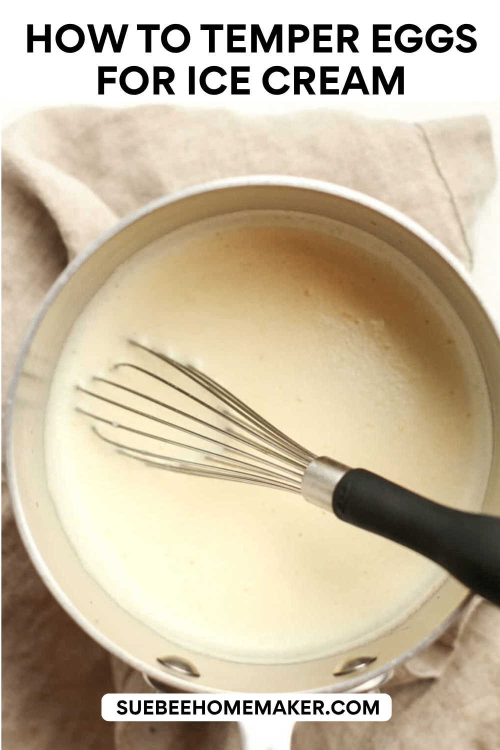 A saucepan of the tempered eggs with a whisk.