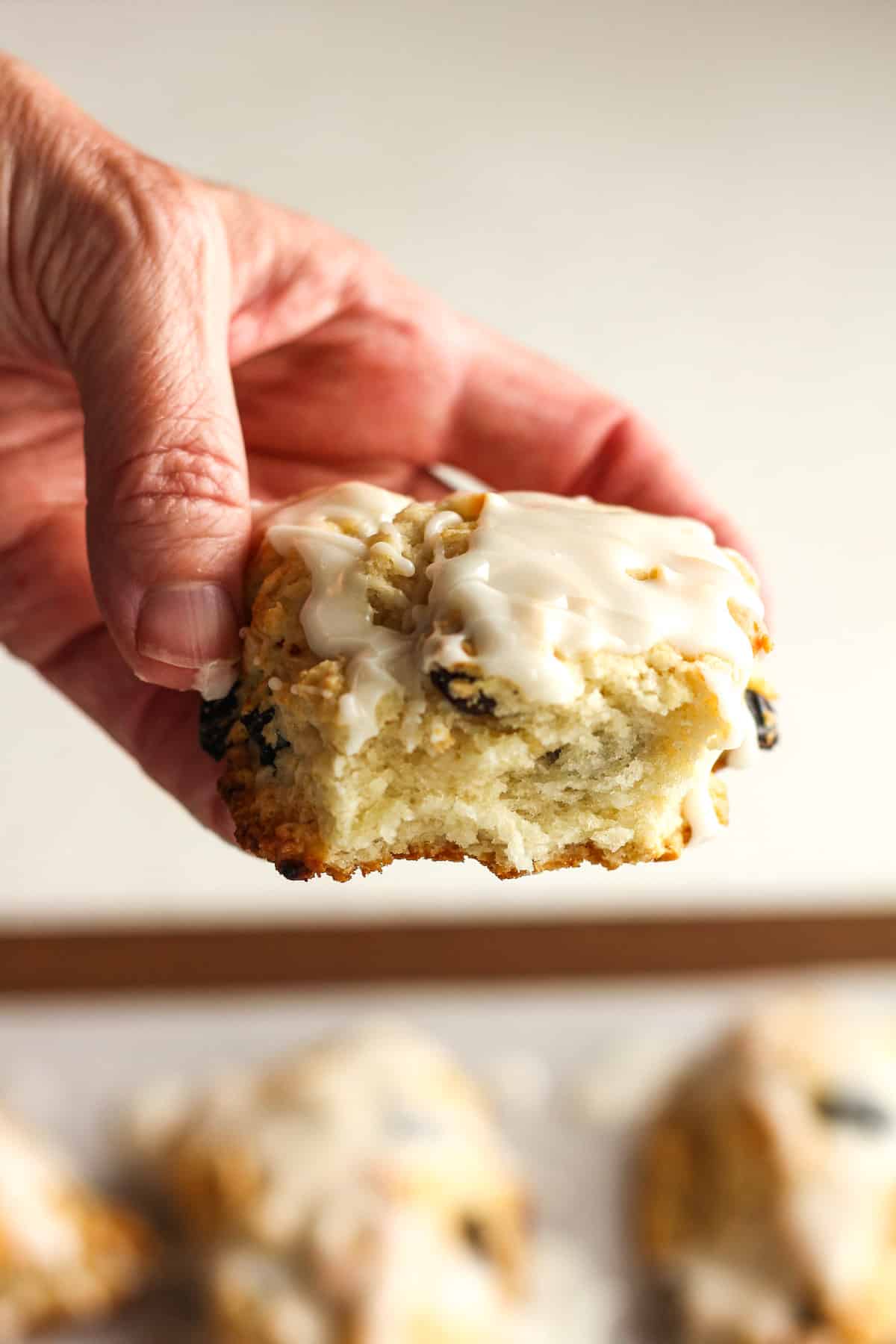 My hand holding part of a scone.