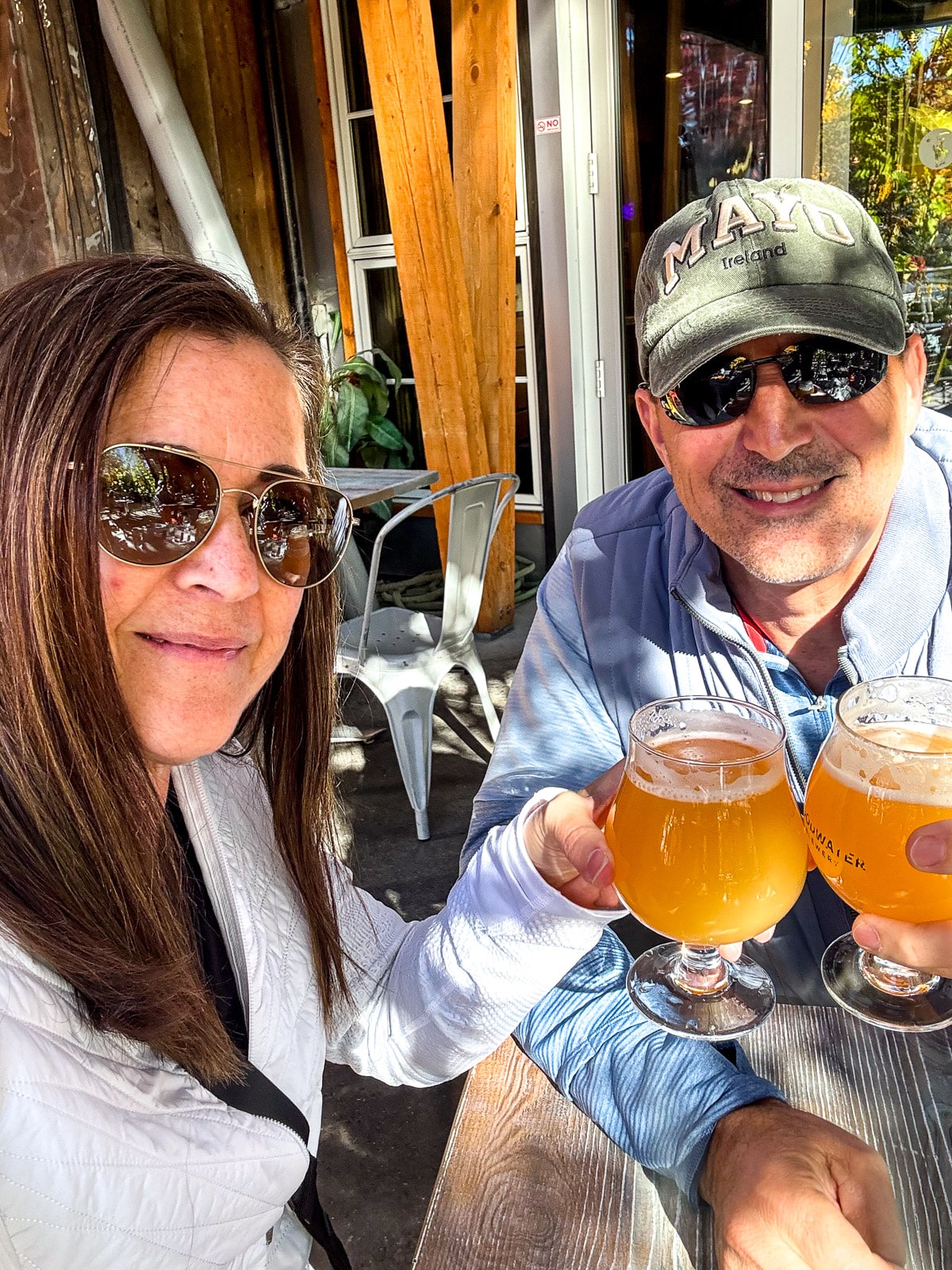 Me and Mike clinking our beers at the pizza place.