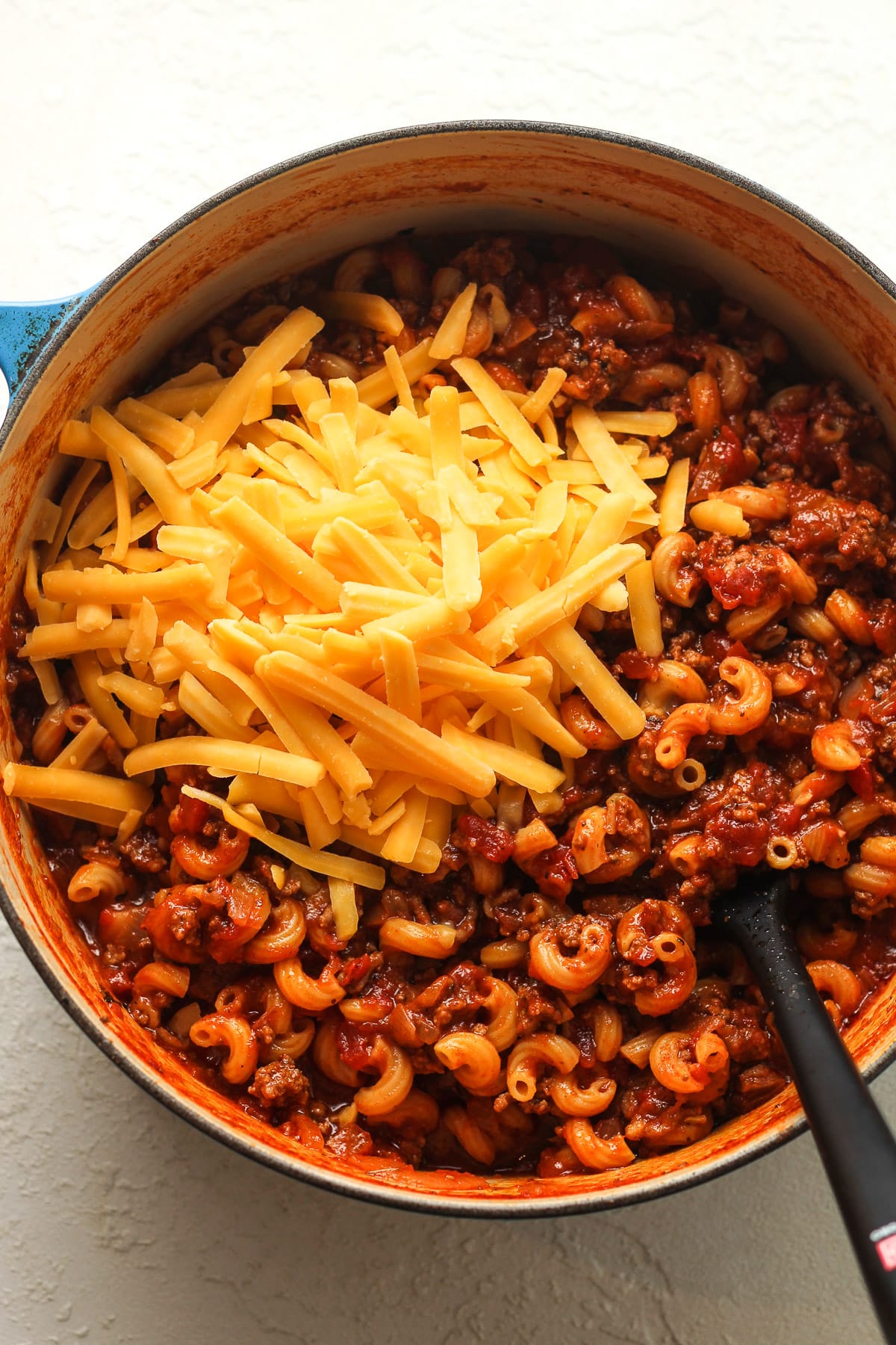 The pot of goulash before stirring in the cheddar cheese.